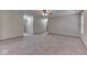 An expansive living room with neutral carpet and a ceiling fan provides ample space for relaxation at 6010 Rocky River Dr, Indianapolis, IN 46221