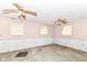 Spacious basement featuring two ceiling fans, several windows and white brick accent walls at 6238 E 43Rd St, Indianapolis, IN 46226