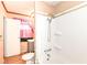 Bright bathroom featuring a tub, shower, vanity, toilet, and window at 6238 E 43Rd St, Indianapolis, IN 46226