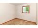 Empty bedroom featuring one window with a wood frame and neutral colored walls and carpet at 6238 E 43Rd St, Indianapolis, IN 46226