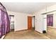 Bedroom featuring sliding closet doors, a window, neutral colored walls, and carpet at 6238 E 43Rd St, Indianapolis, IN 46226
