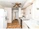 A kitchen needing repair with white cabinets and a linoleum floor at 6238 E 43Rd St, Indianapolis, IN 46226