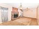 Spacious living room with a large brick fireplace and two ceiling fans at 6238 E 43Rd St, Indianapolis, IN 46226