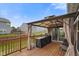 Spacious back deck featuring a gazebo, grill, and a view of the backyard and nearby homes at 6415 Calabash Pl, Indianapolis, IN 46217