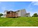 Exterior view of home featuring a wooden deck with a gazebo and a lush green backyard at 6415 Calabash Pl, Indianapolis, IN 46217