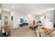 Cozy living room with a spacious seating area, open to the kitchen, and ample natural light at 6415 Calabash Pl, Indianapolis, IN 46217