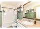 Well lit bathroom with a shower/tub combination and a vanity with a sink at 6556 Sulgrove Pl, Indianapolis, IN 46221