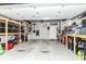 Spacious garage with ample storage shelves and a well-organized workstation, ideal for projects and storage at 6556 Sulgrove Pl, Indianapolis, IN 46221