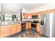 Kitchen featuring modern stainless steel appliances and ample counter space at 6556 Sulgrove Pl, Indianapolis, IN 46221