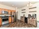 Stylish kitchen with stainless steel appliances, light wood cabinets, and modern decor at 6556 Sulgrove Pl, Indianapolis, IN 46221