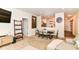 Stylish living area with adjacent dining space, entertainment center, and seamless flow to other rooms at 6556 Sulgrove Pl, Indianapolis, IN 46221