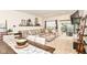 Bright living room showcases a cozy sectional sofa, decor shelves, and sliding glass doors leading to outdoor patio at 6556 Sulgrove Pl, Indianapolis, IN 46221