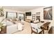 Inviting living room featuring a comfortable sectional sofa, TV, and dining area with stylish decor and sliding door to patio at 6556 Sulgrove Pl, Indianapolis, IN 46221