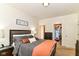 Relaxing primary bedroom featuring a cozy bed, walk-in closet, and soft lighting for a peaceful atmosphere at 6556 Sulgrove Pl, Indianapolis, IN 46221