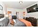 Spacious bedroom features a TV, walk-in closets, dresser, and a comfortable bed for relaxation at 6556 Sulgrove Pl, Indianapolis, IN 46221