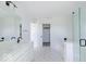 Modern bathroom featuring double vanity, glass shower, and patterned tile flooring at 6771 W Buck Stone Dr, McCordsville, IN 46055