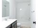 A well-lit bathroom includes a shower and tub combination, vanity, and commode at 6771 W Buck Stone Dr, McCordsville, IN 46055