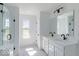Bright bathroom with double sinks, stylish fixtures, and a glass enclosed shower at 6771 W Buck Stone Dr, McCordsville, IN 46055