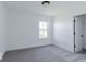 Simple bedroom with large window, neutral carpet, and easy access to closet at 6771 W Buck Stone Dr, McCordsville, IN 46055