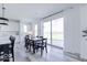 Bright kitchen area featuring a dining table and sliding glass doors to the backyard at 6771 W Buck Stone Dr, McCordsville, IN 46055