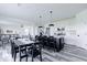Open concept kitchen and dining area with a large island and a dining table at 6771 W Buck Stone Dr, McCordsville, IN 46055