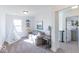 Upstairs living room featuring a gray sofa, play tent, and neutral decor at 6771 W Buck Stone Dr, McCordsville, IN 46055