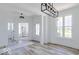 Bright and airy living room with wood floors, white walls, and natural light at 6771 W Buck Stone Dr, McCordsville, IN 46055