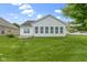 Green backyard with a manicured lawn and exterior view of the home at 7128 Willow Pond Dr, Noblesville, IN 46062
