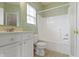 Bathroom with white vanity, toilet, and tub/shower combination at 7128 Willow Pond Dr, Noblesville, IN 46062