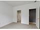Bedroom with neutral carpet, ensuite bathroom, and ample closet space at 7128 Willow Pond Dr, Noblesville, IN 46062