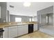 Traditional kitchen features white cabinetry and an open layout to other rooms for easy socializing at 7128 Willow Pond Dr, Noblesville, IN 46062