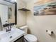 Small bathroom features modern fixtures, decor, and a white vessel sink at 7541 Southern Lakes Dr, Indianapolis, IN 46237