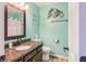 Updated bathroom features a granite vanity, bronze faucet, and modern dolphin decor at 7541 Southern Lakes Dr, Indianapolis, IN 46237
