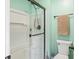Clean bathroom features a glass-enclosed shower with a bronze shower head and coordinating towel rack at 7541 Southern Lakes Dr, Indianapolis, IN 46237