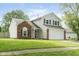 Charming two-story home with brick accents and a well-manicured lawn at 7541 Southern Lakes Dr, Indianapolis, IN 46237