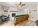 Bright living room with a fireplace, natural lighting, and light wood plank flooring at 7541 Southern Lakes Dr, Indianapolis, IN 46237