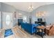 Bright living room featuring a blue sofa, hardwood floors, and stylish decorations at 7541 Southern Lakes Dr, Indianapolis, IN 46237