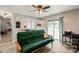Open living area with bar seating, sliding glass doors, and light wood plank flooring at 7541 Southern Lakes Dr, Indianapolis, IN 46237