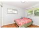 Cozy bedroom with hardwood floors and a bright window at 7725 E 52Nd St, Indianapolis, IN 46226