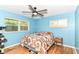 Comfortable bedroom with a ceiling fan and natural light at 7725 E 52Nd St, Indianapolis, IN 46226