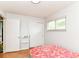 Bright bedroom with ample closet space and hardwood floors at 7725 E 52Nd St, Indianapolis, IN 46226