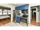 Functional kitchen with stainless steel appliances, ample cabinet space, and tiled flooring at 7725 E 52Nd St, Indianapolis, IN 46226
