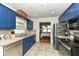 Efficient kitchen featuring ample counter space, tiled flooring, and stainless steel appliances at 7725 E 52Nd St, Indianapolis, IN 46226