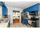 Bright kitchen with stainless steel appliances and view to dining area at 7725 E 52Nd St, Indianapolis, IN 46226