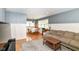 Inviting living room with hardwood floors, neutral paint, and open layout to the dining area at 7725 E 52Nd St, Indianapolis, IN 46226