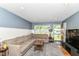 Comfortable living room with a large sectional sofa and ample natural light at 7725 E 52Nd St, Indianapolis, IN 46226