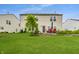 Well-kept backyard showcasing lawn, patio seating, and exterior view of the two-story home at 8088 Lantern Ln, Pendleton, IN 46064
