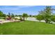 Expansive backyard featuring a patio set, green lawn, and serene lake view in a residential neighborhood at 8088 Lantern Ln, Pendleton, IN 46064