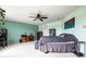 Spacious bedroom features soft carpet, ceiling fan, and modern decor for a calming retreat at 8088 Lantern Ln, Pendleton, IN 46064
