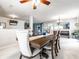 Open-concept dining area with large wood table and upholstered chairs, great for Gathering gatherings at 8088 Lantern Ln, Pendleton, IN 46064